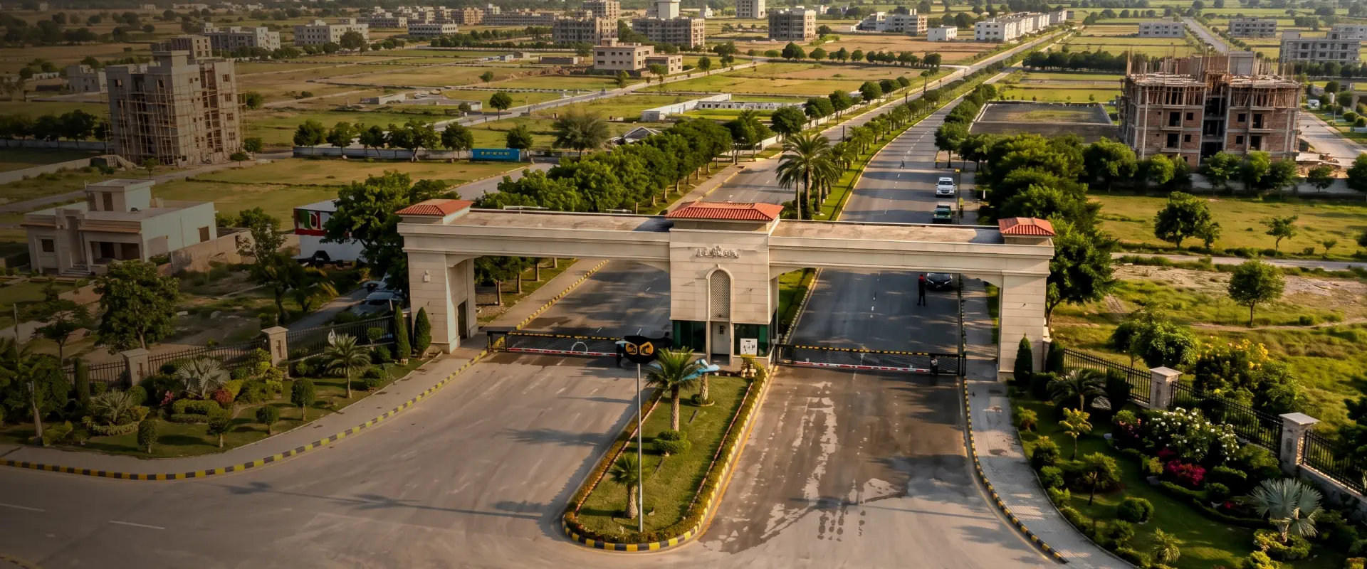 Aerial view of the gated entrance to farm house plots on Fateh Jang Road, offered by Sadiqeen Group